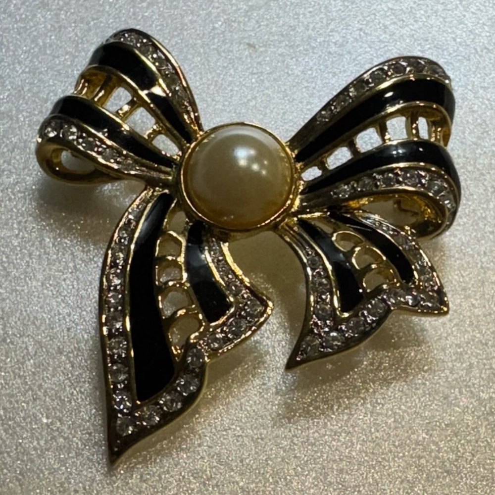 Elegant Black and Gold Bow Brooch with Pearl Center